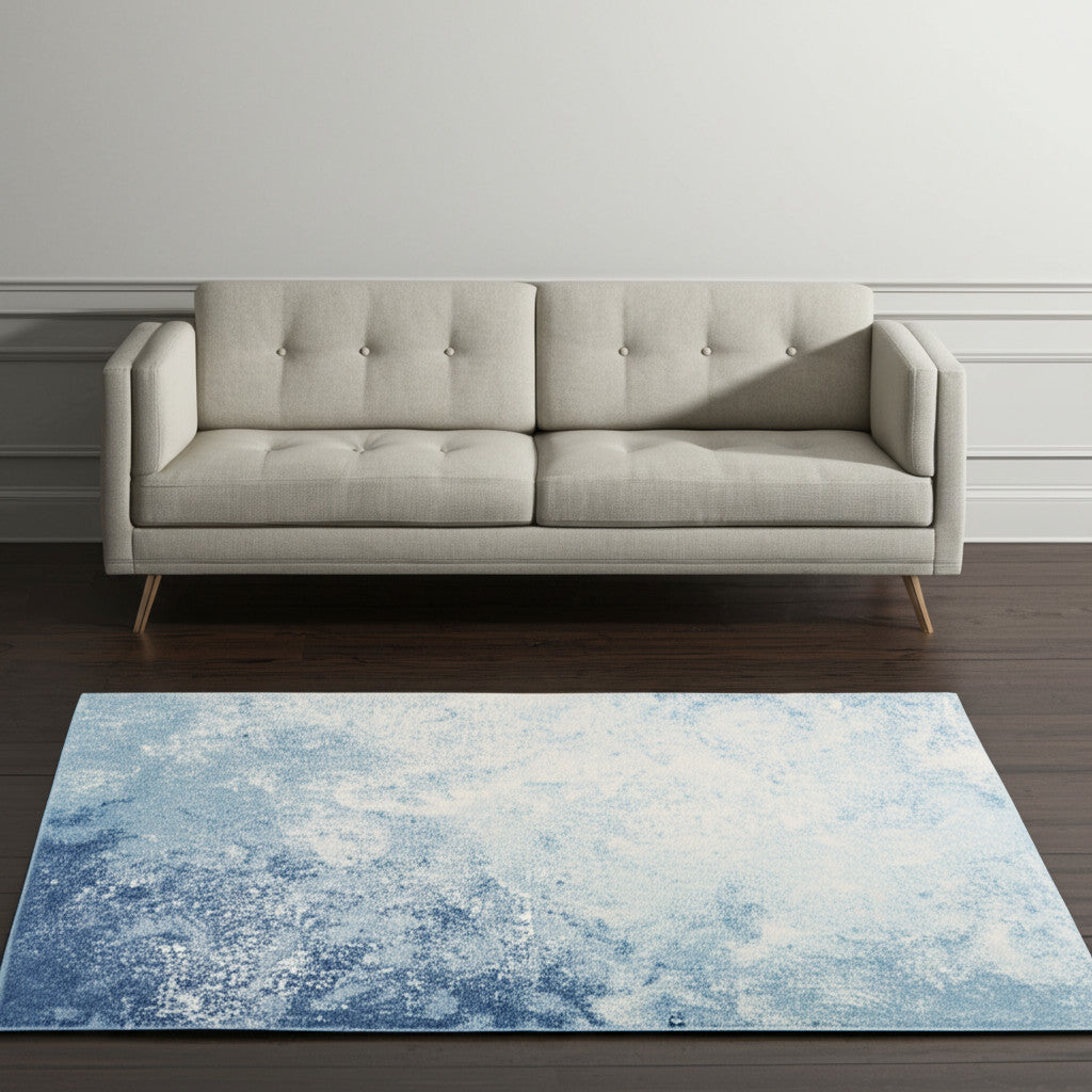 5' X 7' Blue And Ivory Abstract Area Rug